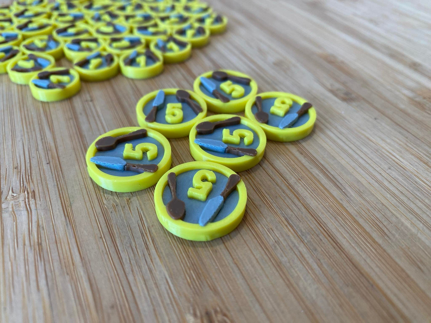 Agricola board game upgrade tokens close up 5 tokens